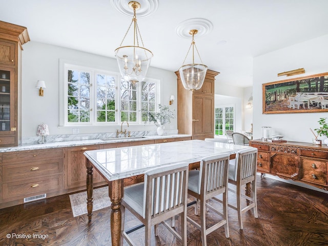 180 De Windt Rd, Winnetka, IL 60093 - dining space featuring a notable chandelier and visible vents