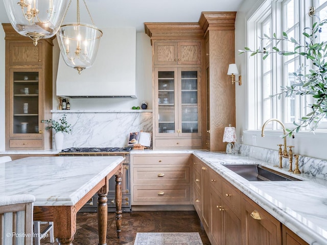 180 De Windt Rd, Winnetka, IL 60093 - kitchen with a sink, glass insert cabinets, tasteful backsplash, and a notable chandelier