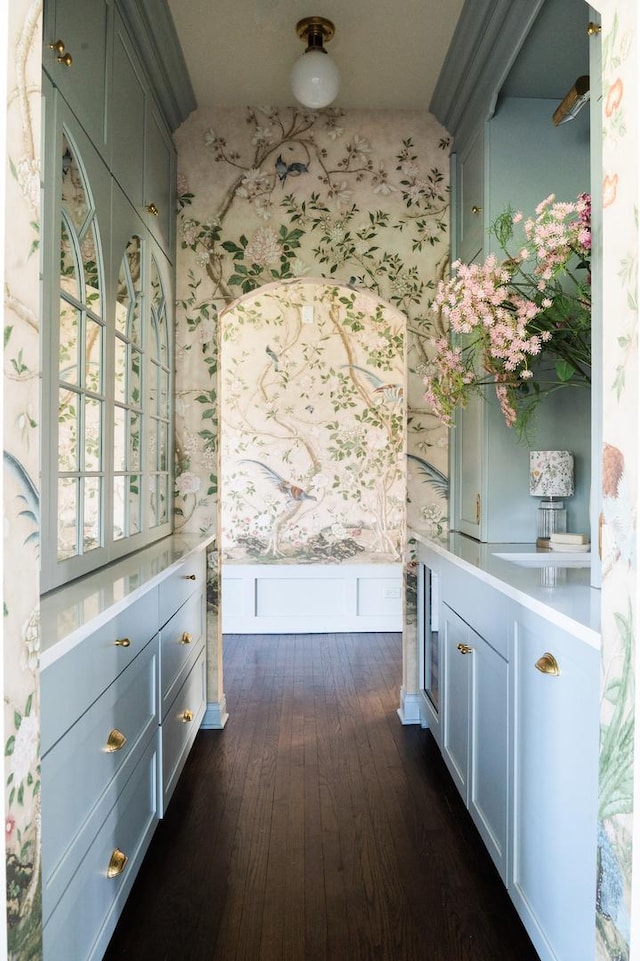 180 De Windt Rd, Winnetka, IL 60093 - corridor featuring wainscoting, dark wood-style floors, and wallpapered walls