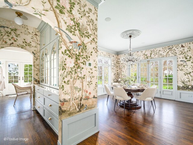 180 De Windt Rd, Winnetka, IL 60093 - dining area featuring dark wood-style flooring, wallpapered walls, ornamental molding, and a wealth of natural light