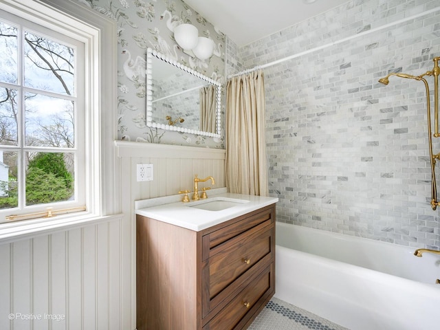 180 De Windt Rd, Winnetka, IL 60093 - full bath featuring vanity, plenty of natural light, a wainscoted wall, and shower / bath combination with curtain