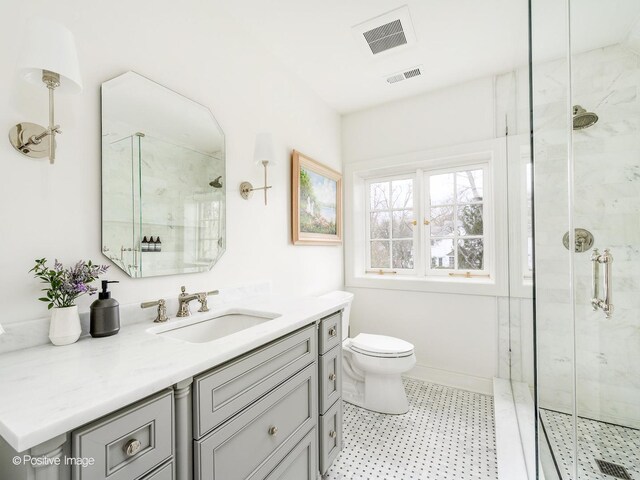 180 De Windt Rd, Winnetka, IL 60093 - bathroom with vanity, a shower stall, toilet, and visible vents