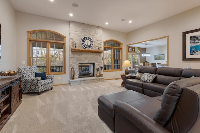 carpeted living area featuring a fireplace, recessed lighting, and baseboards