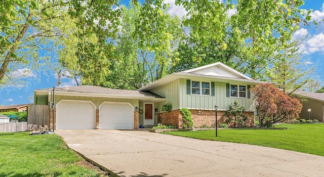 tri-level home featuring a front yard, brick siding, board and batten siding, concrete driveway, and an attached garage