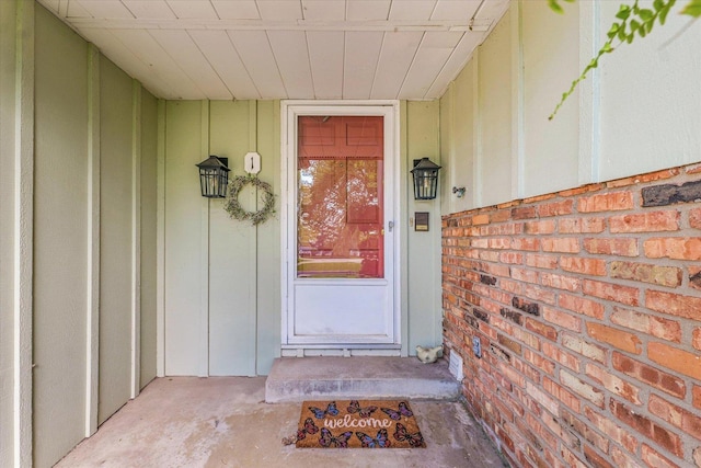 entrance to property featuring board and batten siding