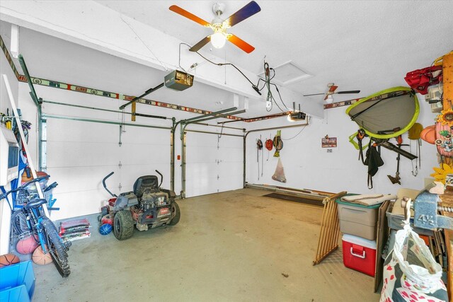 garage with a garage door opener and a ceiling fan