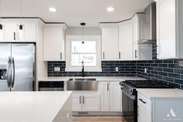 10945 S Neenah Ave, Worth, IL 60482 - kitchen featuring wall chimney exhaust hood, white cabinets, a sink, and appliances with stainless steel finishes