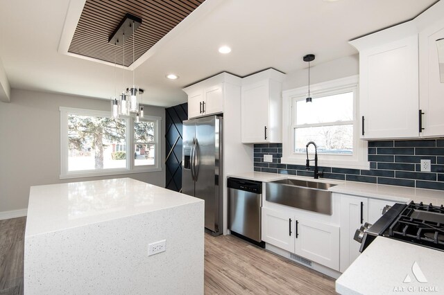 10945 S Neenah Ave, Worth, IL 60482 - kitchen featuring a sink, plenty of natural light, recessed lighting, light wood-style floors, and appliances with stainless steel finishes