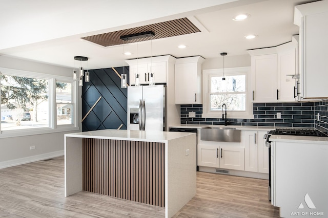 10945 S Neenah Ave, Worth, IL 60482 - kitchen with tasteful backsplash, appliances with stainless steel finishes, white cabinetry, and a sink