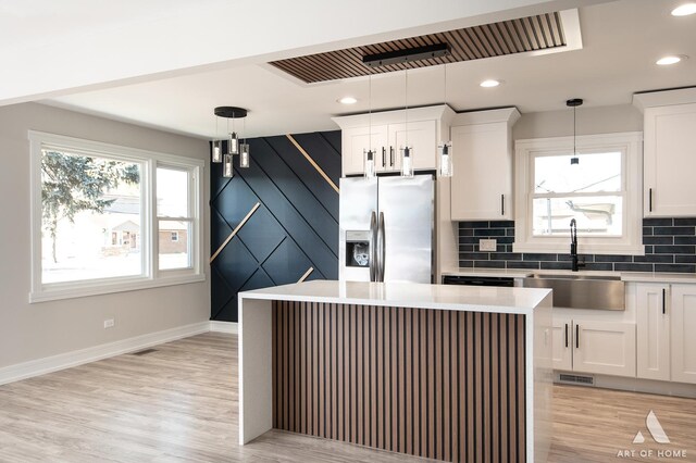 10945 S Neenah Ave, Worth, IL 60482 - kitchen with plenty of natural light, a sink, tasteful backsplash, and stainless steel fridge with ice dispenser