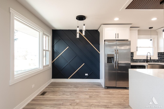 10945 S Neenah Ave, Worth, IL 60482 - kitchen featuring stainless steel fridge, visible vents, pendant lighting, and a sink