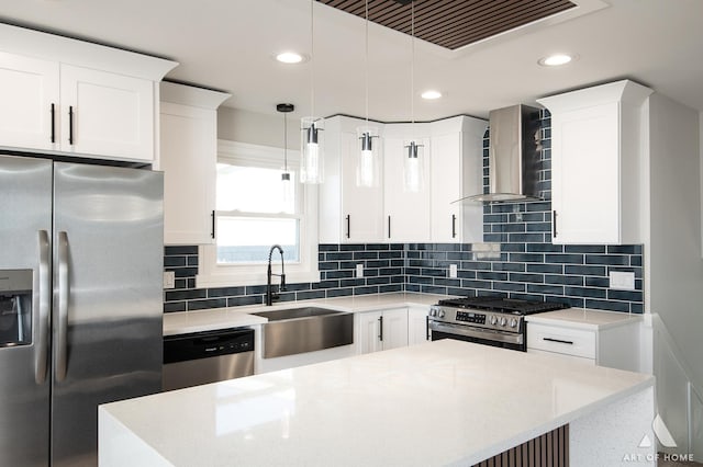 10945 S Neenah Ave, Worth, IL 60482 - kitchen featuring stainless steel appliances, recessed lighting, white cabinetry, wall chimney range hood, and decorative light fixtures