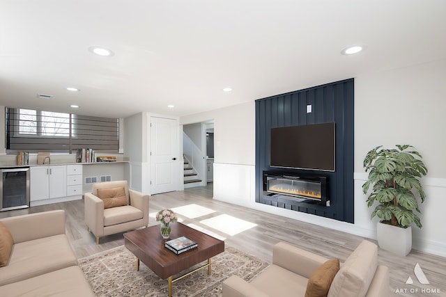 10945 S Neenah Ave, Worth, IL 60482 - living room featuring recessed lighting, beverage cooler, and stairs