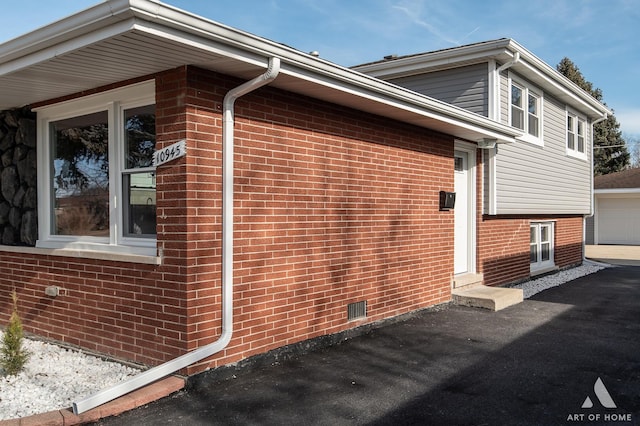 10945 S Neenah Ave, Worth, IL 60482 - view of side of property featuring brick siding and a garage