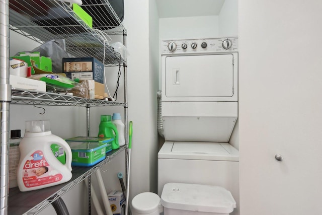 washroom with stacked washer and clothes dryer