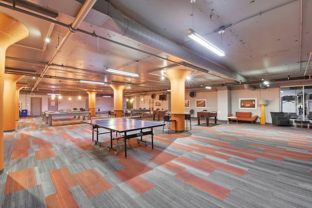 recreation room with carpet floors and ornate columns