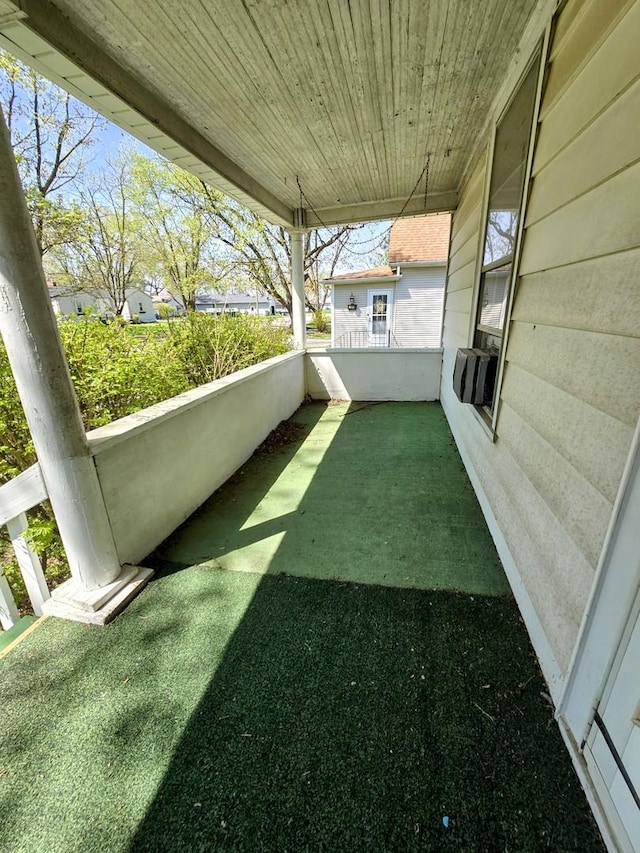view of yard with a porch and cooling unit