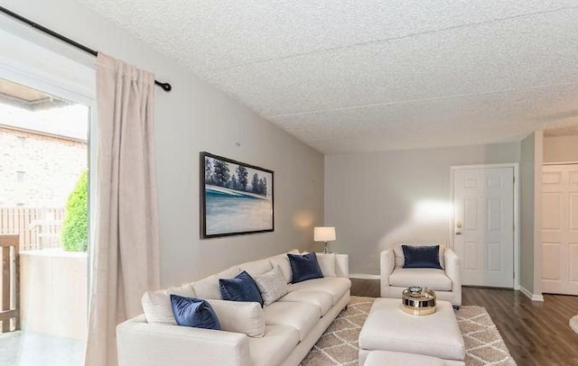 1472 N Rock Run Dr Unit 1C, Crest Hill, IL 60403 - living room featuring a textured ceiling, dark wood finished floors, and baseboards