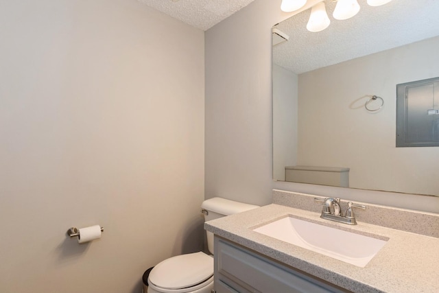 1472 N Rock Run Dr Unit 1C, Crest Hill, IL 60403 - half bathroom with toilet, a textured ceiling, electric panel, and vanity