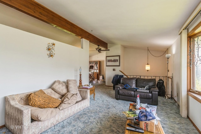 living area featuring vaulted ceiling with beams, carpet floors, and a wealth of natural light