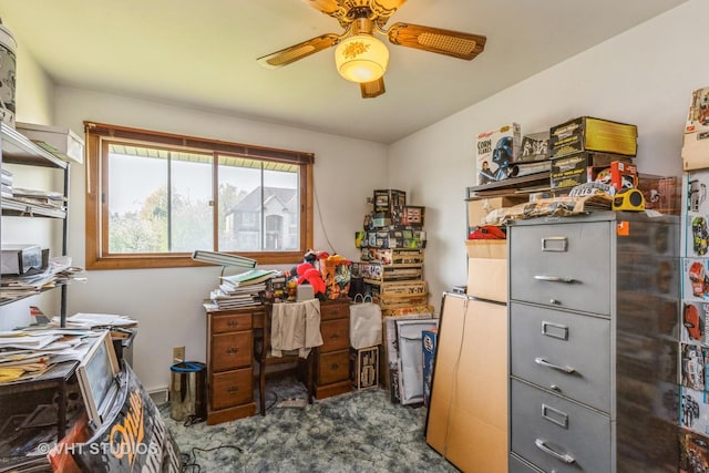 office area featuring a ceiling fan and dark colored carpet