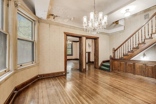 1312 N Astor St, Chicago, IL 60610 - spare room with a chandelier, stairs, wood finished floors, and baseboards