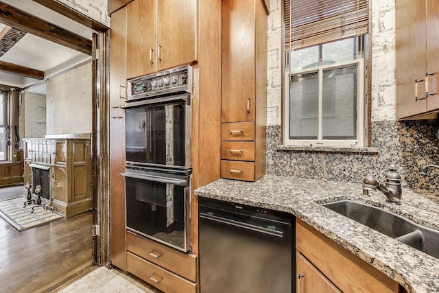 1312 N Astor St, Chicago, IL 60610 - kitchen featuring black appliances, a sink, tasteful backsplash, and plenty of natural light