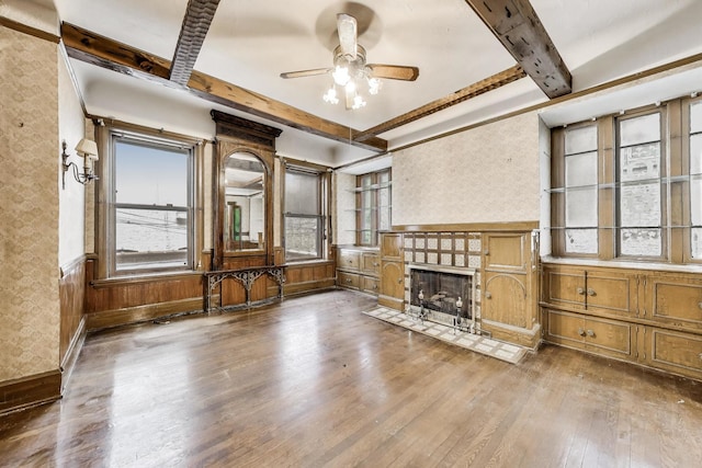1312 N Astor St, Chicago, IL 60610 - unfurnished living room featuring wood-type flooring, a ceiling fan, beam ceiling, a fireplace with flush hearth, and wallpapered walls