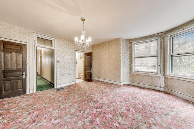 1312 N Astor St, Chicago, IL 60610 - unfurnished dining area featuring wallpapered walls, a chandelier, carpet flooring, and baseboards