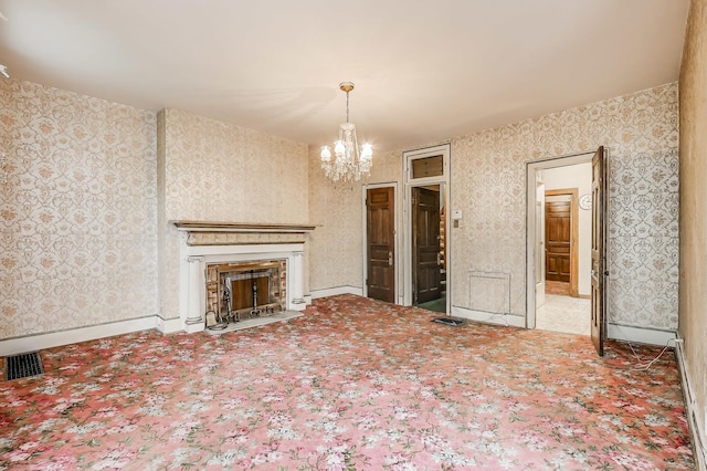 1312 N Astor St, Chicago, IL 60610 - unfurnished living room with carpet flooring, a chandelier, a fireplace, wallpapered walls, and baseboards