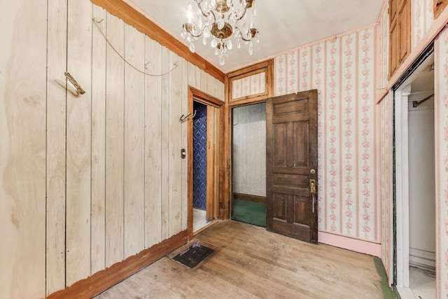 1312 N Astor St, Chicago, IL 60610 - entryway with a chandelier, light wood-style floors, and wallpapered walls