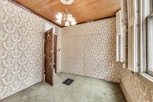 1312 N Astor St, Chicago, IL 60610 - carpeted spare room featuring a chandelier, wooden ceiling, and ornamental molding