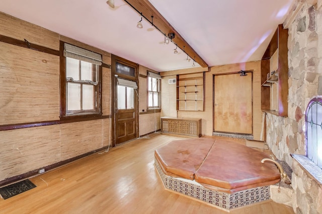 1312 N Astor St, Chicago, IL 60610 - foyer entrance with rail lighting, light wood finished floors, beamed ceiling, radiator heating unit, and wooden walls