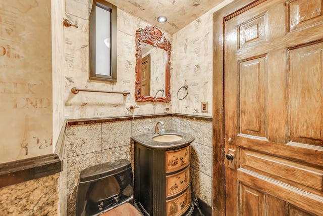 1312 N Astor St, Chicago, IL 60610 - bathroom with vanity, tile walls, and a wainscoted wall
