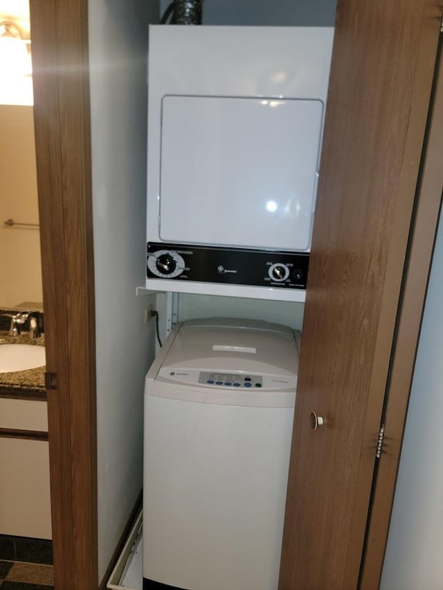 75 Kristin Cir Unit 401, Schaumburg, IL 60195 - clothes washing area featuring stacked washing machine and dryer