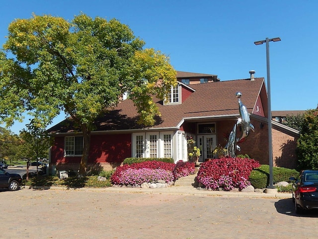 75 Kristin Cir Unit 401, Schaumburg, IL 60195 - view of side of property with roof with shingles