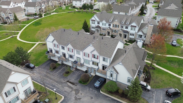 birds eye view of property with a residential view