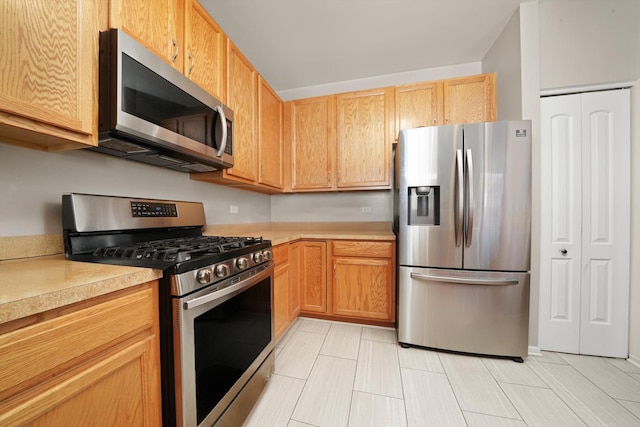 kitchen featuring light countertops and stainless steel appliances