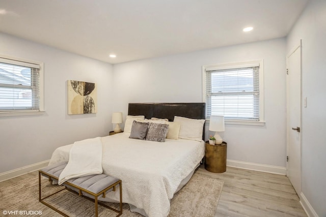 943 Maple Ln, Elk Grove Village, IL 60007 - bedroom with baseboards, wood finished floors, and multiple windows