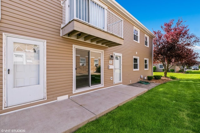 7923 163rd Ct Unit 23, Tinley Park, IL 60477 - back of house featuring a balcony and a lawn