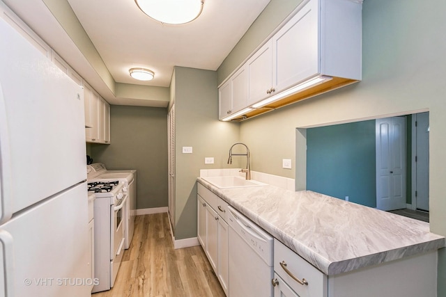 7923 163rd Ct Unit 23, Tinley Park, IL 60477 - kitchen featuring white appliances, a sink, light wood finished floors, white cabinets, and light countertops