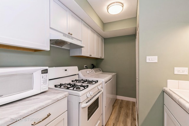 7923 163rd Ct Unit 23, Tinley Park, IL 60477 - kitchen featuring white appliances, under cabinet range hood, light wood-style flooring, and white cabinets