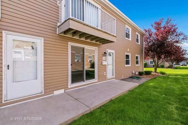 7923 163rd Ct Unit 23, Tinley Park, IL 60477 - back of house featuring a balcony and a lawn