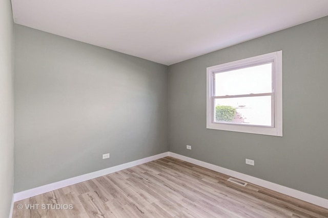 7923 163rd Ct Unit 23, Tinley Park, IL 60477 - unfurnished room with light wood-style floors and baseboards