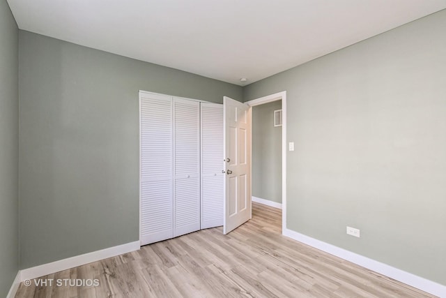 7923 163rd Ct Unit 23, Tinley Park, IL 60477 - unfurnished bedroom with baseboards, wood finished floors, and a closet