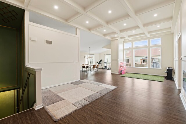 interior space featuring beam ceiling, baseboards, dark wood-style floors, coffered ceiling, and recessed lighting