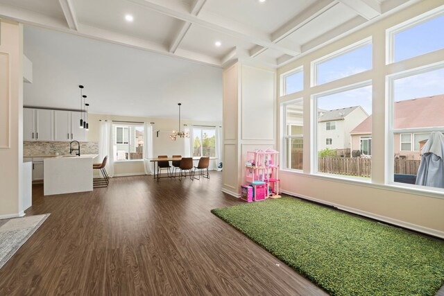 game room with recessed lighting, coffered ceiling, beam ceiling, and dark wood-style floors