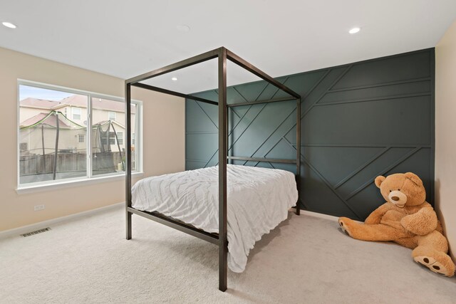 bedroom with carpet floors, recessed lighting, baseboards, and visible vents