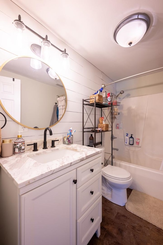 full bathroom featuring toilet, vanity, and shower / bath combination with curtain