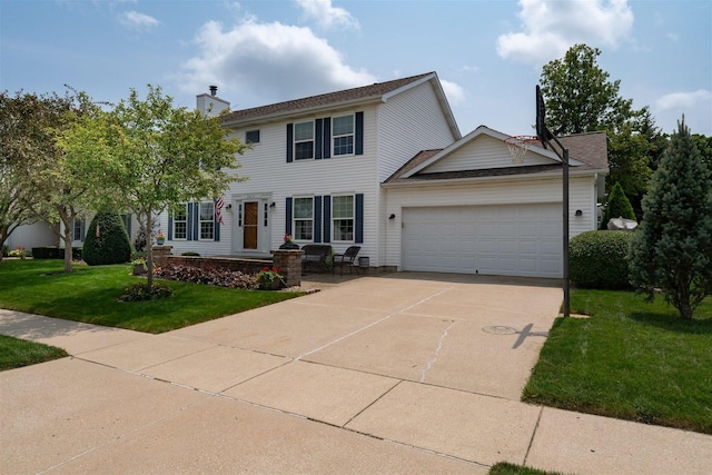 colonial-style house featuring a chimney, a garage, a front yard, and concrete driveway